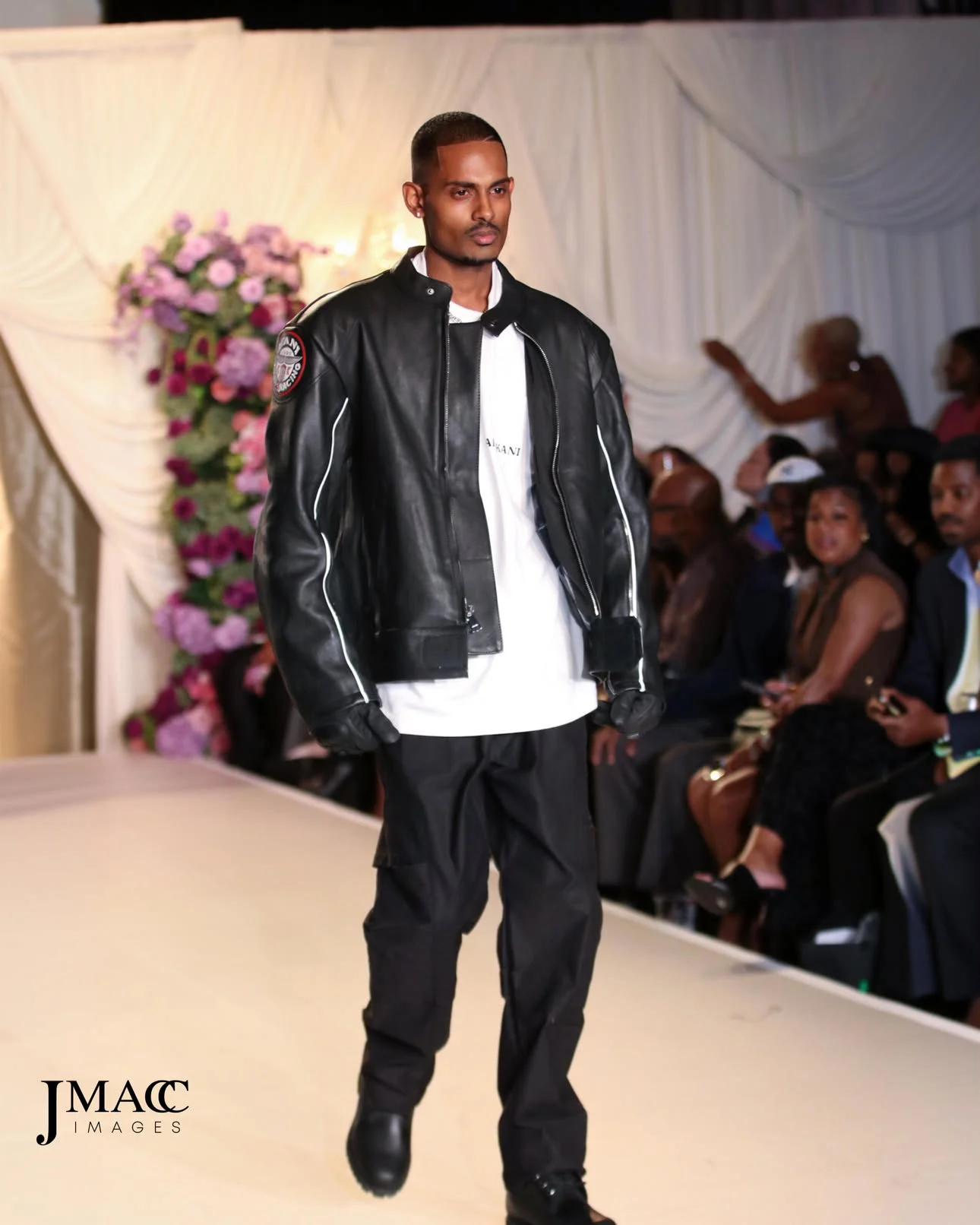 NIJO passing the front row at the Emerge! Show for Karl Kani