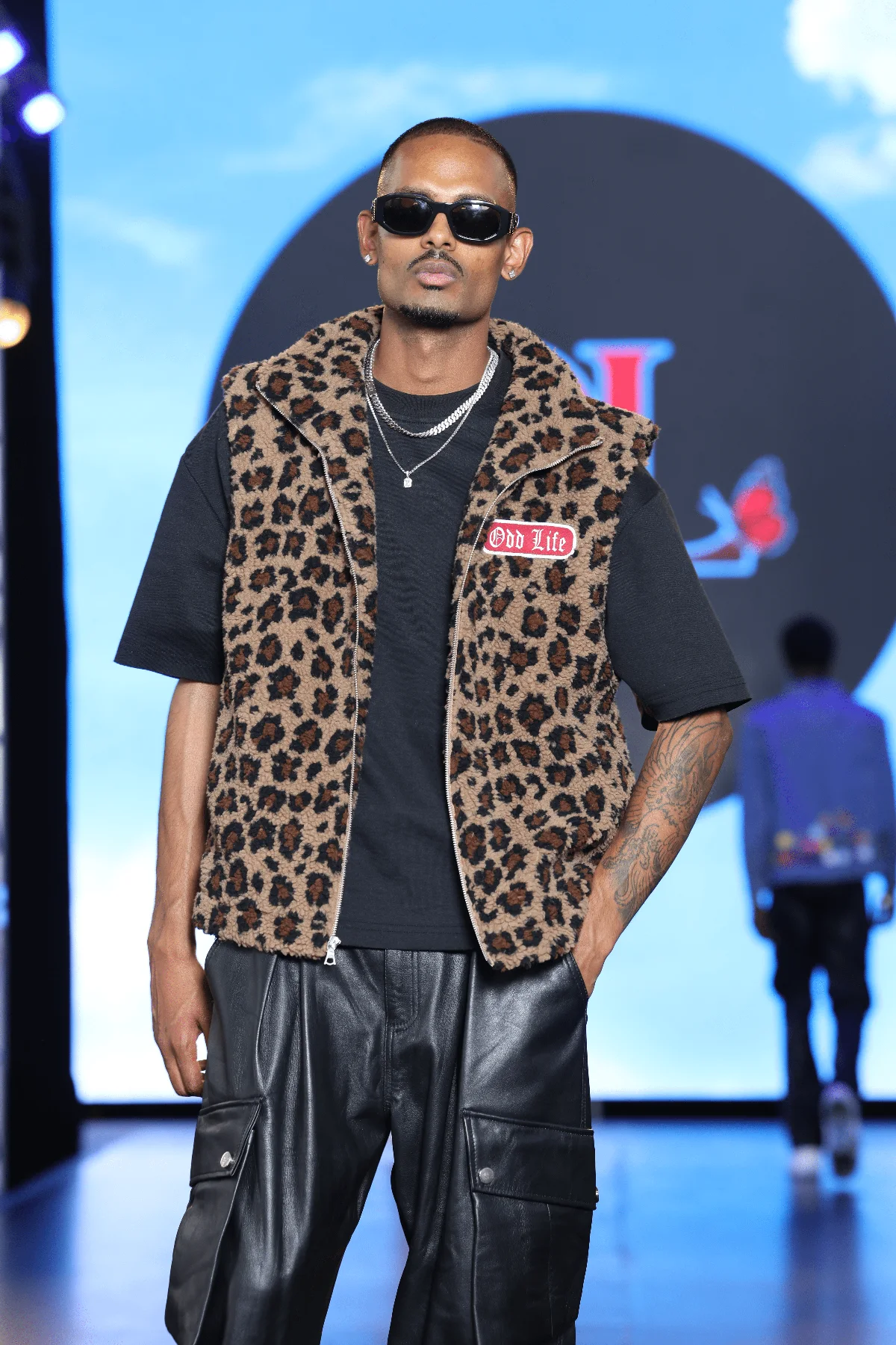 NIJO on the NYFW Festival runway for Odd Life — leopard sherpa vest and leather cargo trousers