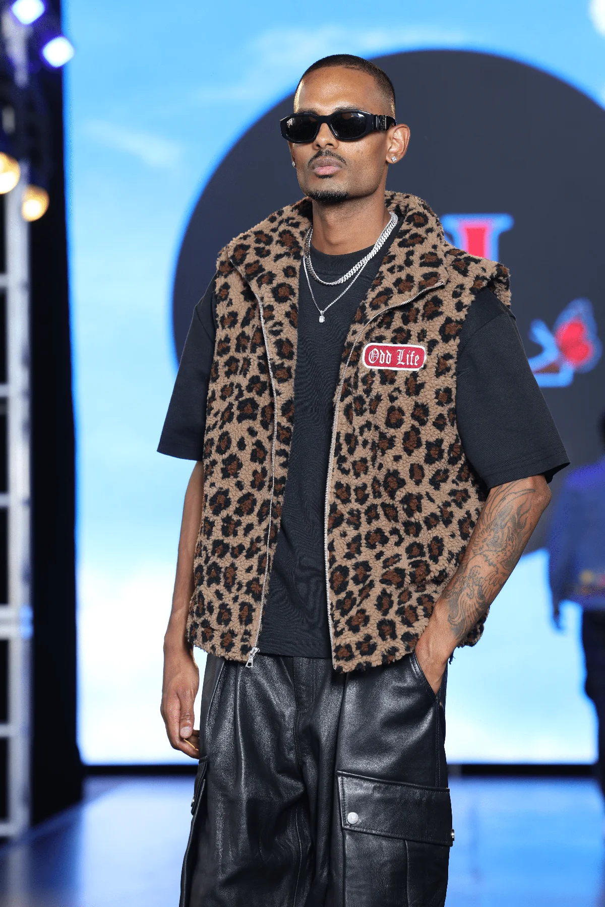 NIJO at the end of the NYFW Festival runway for Odd Life, leopard sherpa vest and leather cargo trousers