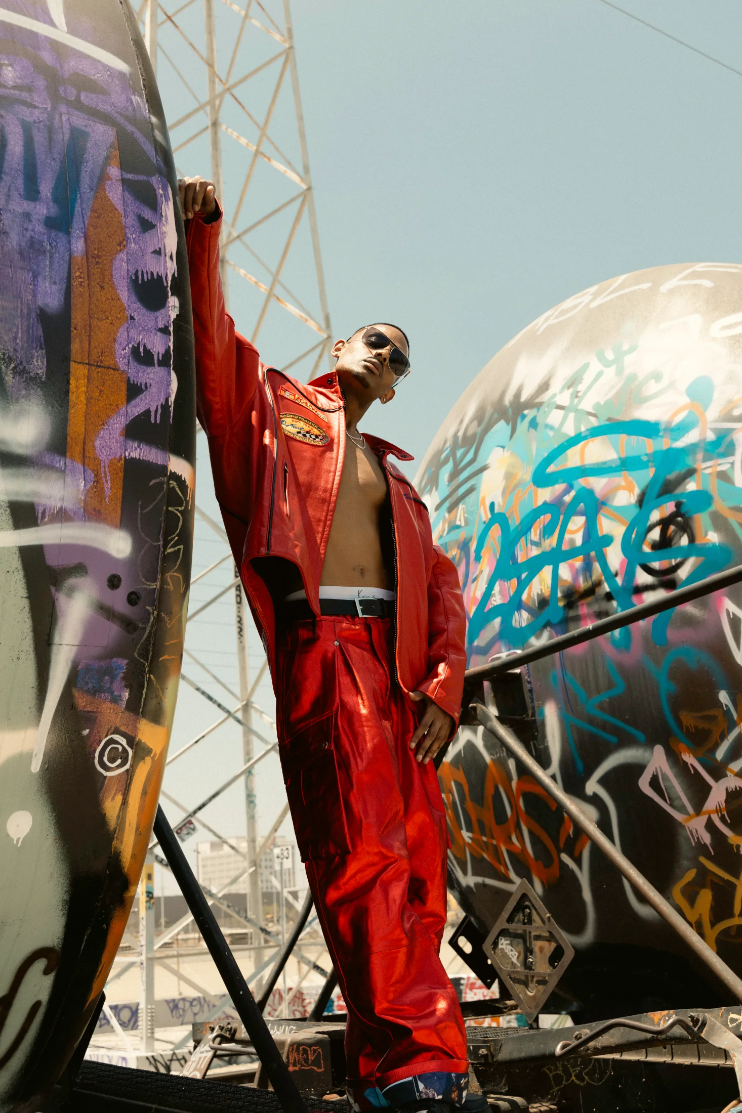 NIJO in Karl Kani Racing red leather two-piece — graffiti yards, Los Angeles