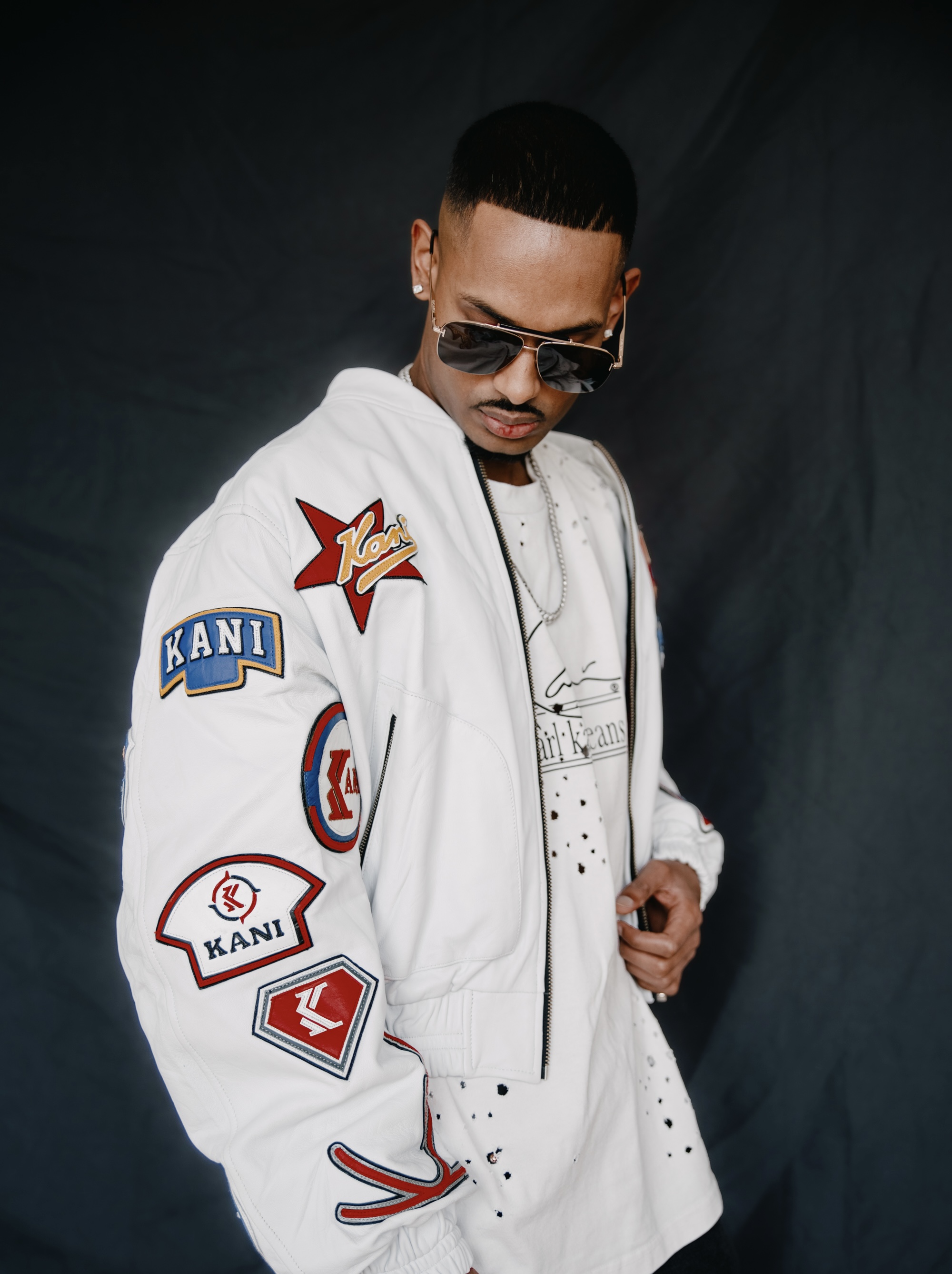 NIJO — Karl Kani 35mm Film bomber, white-on-white, race patches