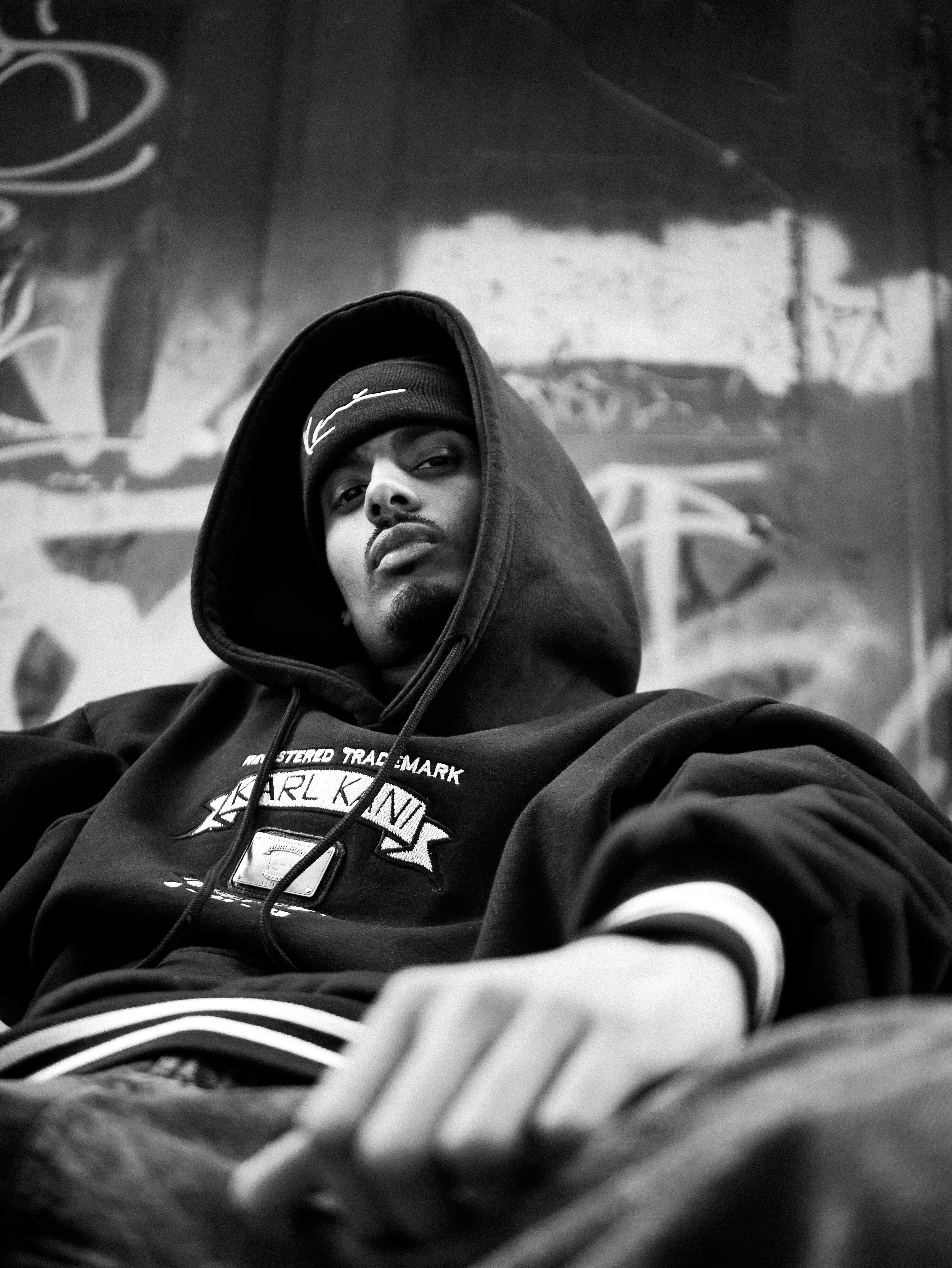 NIJO — New York City, Karl Kani hoodie before graffiti wall